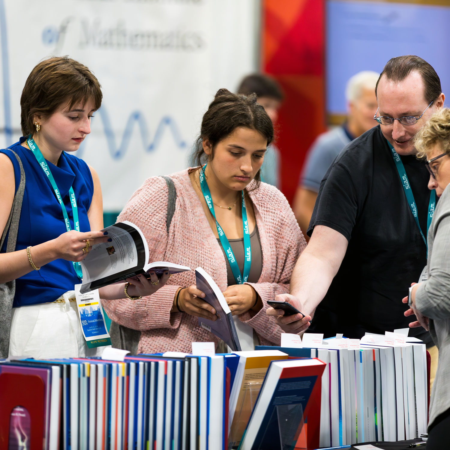 Group of kids looking into a light desk.
