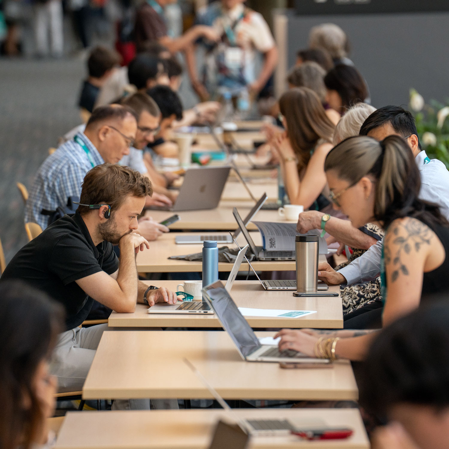 Group of kids looking into a light desk.
