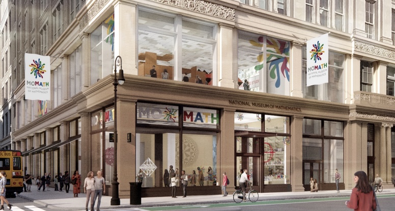 Group of kids looking into a light desk.